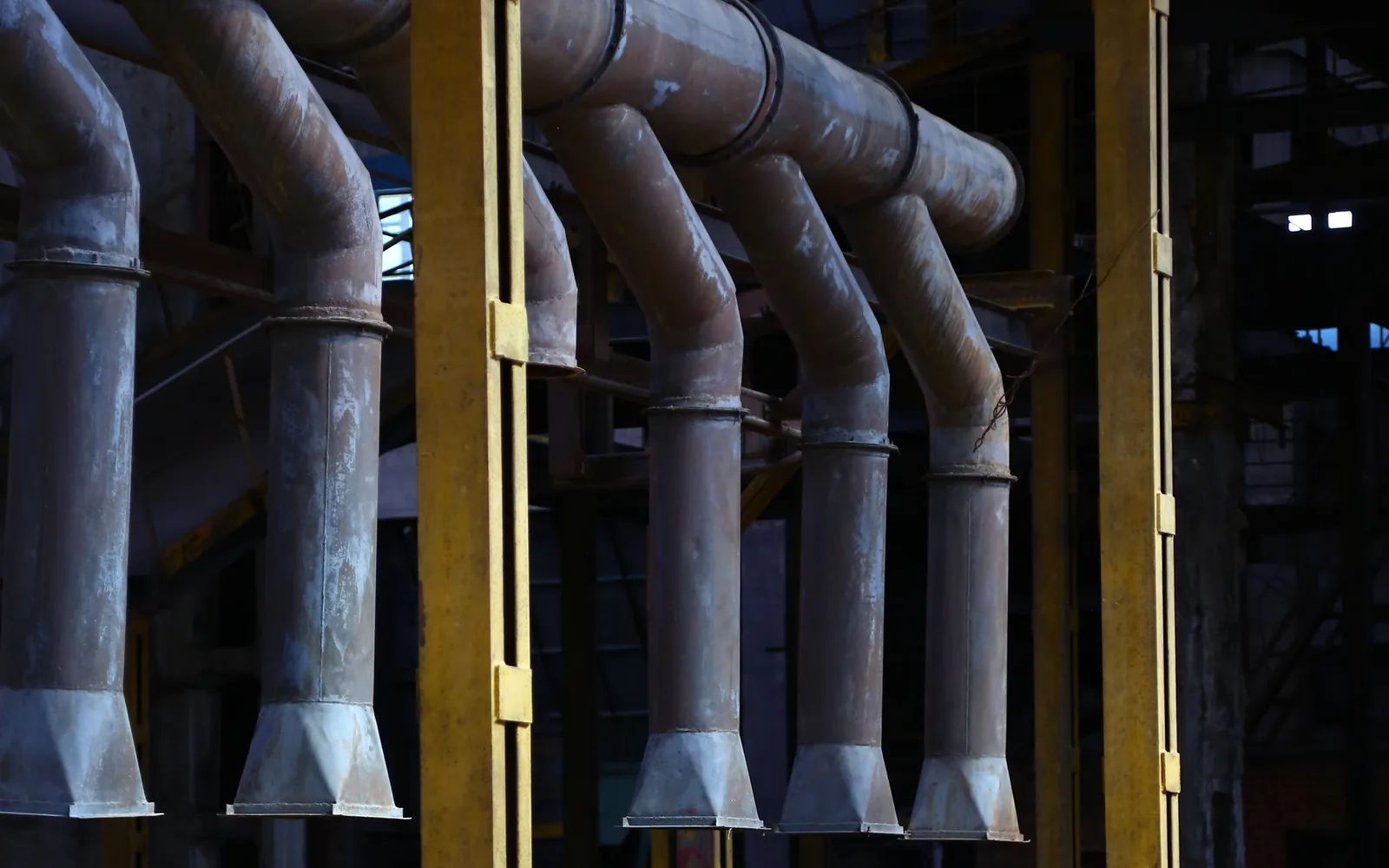 Large industrial pipework inside a processing plant